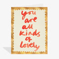 Card with red text 'you are all kinds of lovely' on a gold border