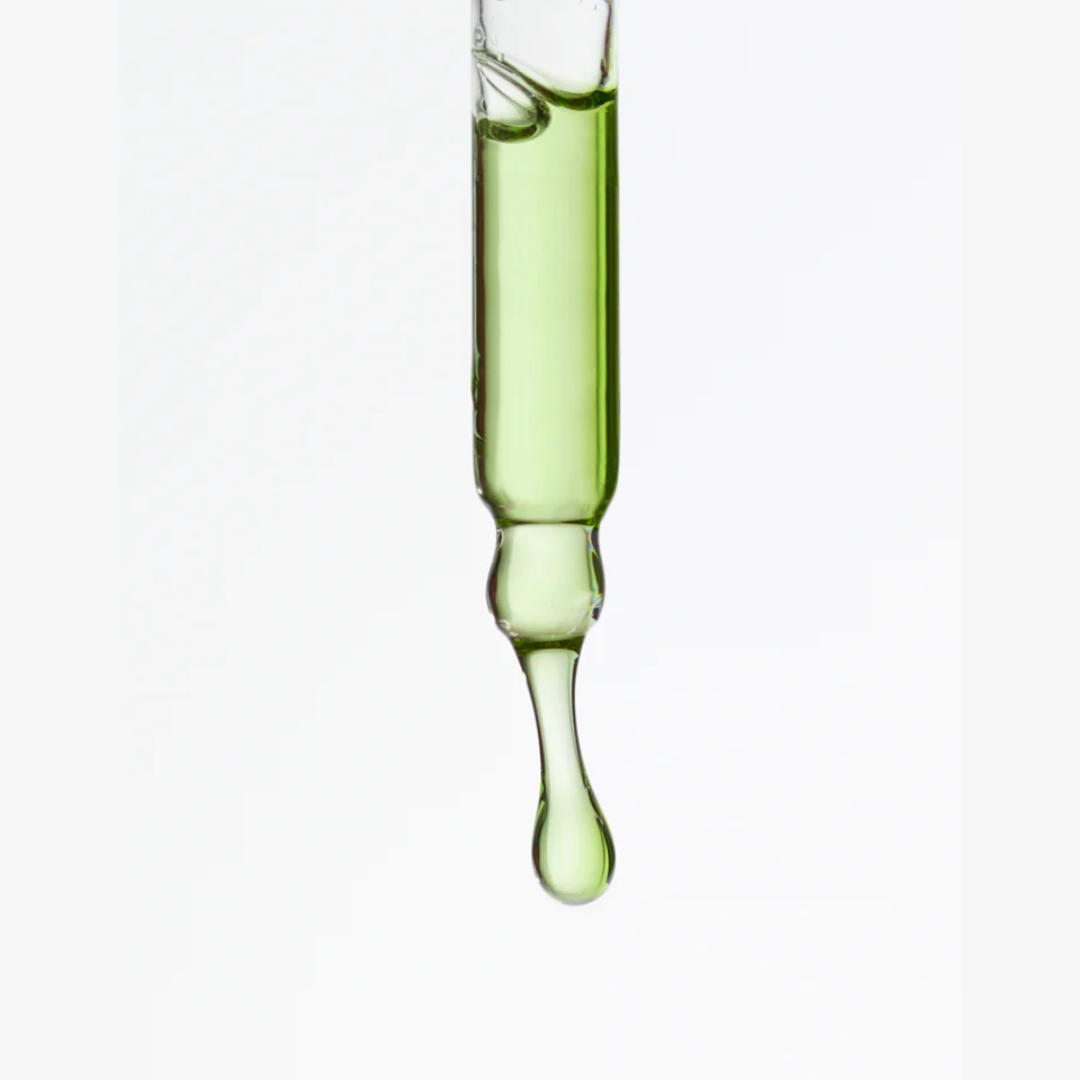 Aide Bodycare Clarifying Face Serum, featuring a small glass bottle with a dropper and a label with 'aide' logo, 'Clarifying Face Serum', and 'tansy & black cumin' text, displayed on a light-colored surface with a soft shadow. The serum is natural and available in Ottawa, Ontario, Canada.