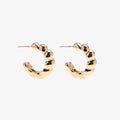 Gold hoop earrings on a white background