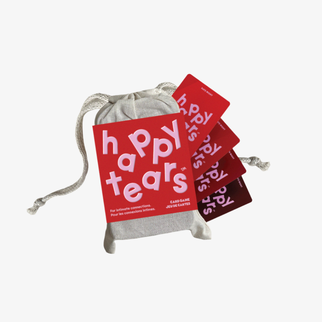 Happy Tears Intimate Connections card game, Ottawa. Red conversation cards in grey drawstring bag. 'Happy Tears' logo, bilingual text: 'For Intimate connections', 'Pour les connexions intimes'. Fun card game for couples.