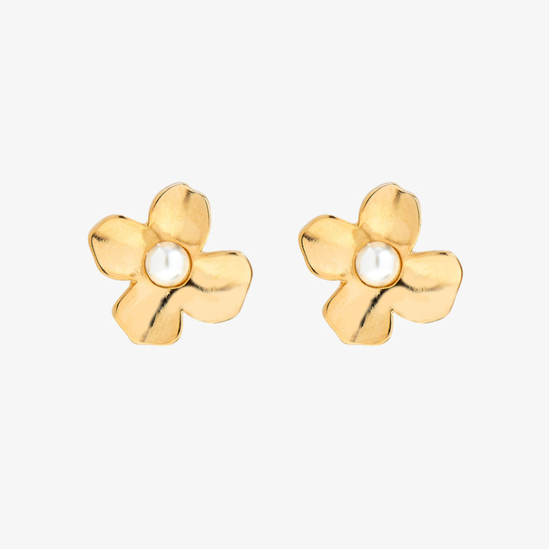 Gold flower-shaped earrings with pearl centers on a white background