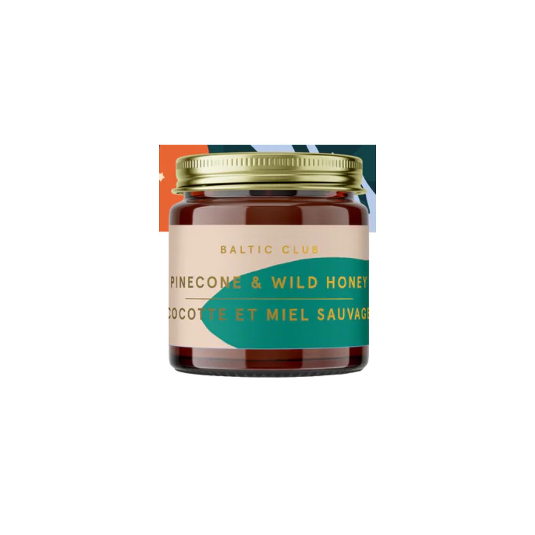Jar of pinecone and wild honey with a visible brand label on a white background