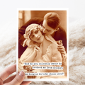 Vintage-style photo of a couple with a humorous text overlay on a textured surface.