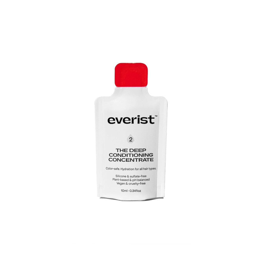 Everist deep conditioning concentrate bottle with red cap on a white background