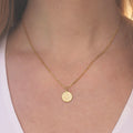 Model Wearing Delicate Gold Zodiac Necklace by Vintage Acorn
